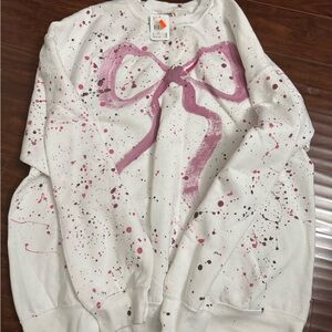 White Sweatshirt with Pink Bow Design